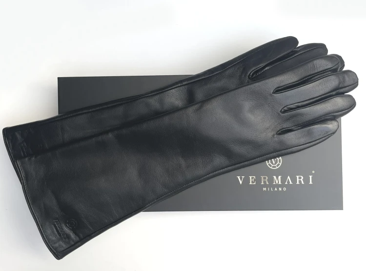 Vermari Milano VWGL-100L - long black leather gloves laid horizontally on a Vermari Milano box, fingers pointing right